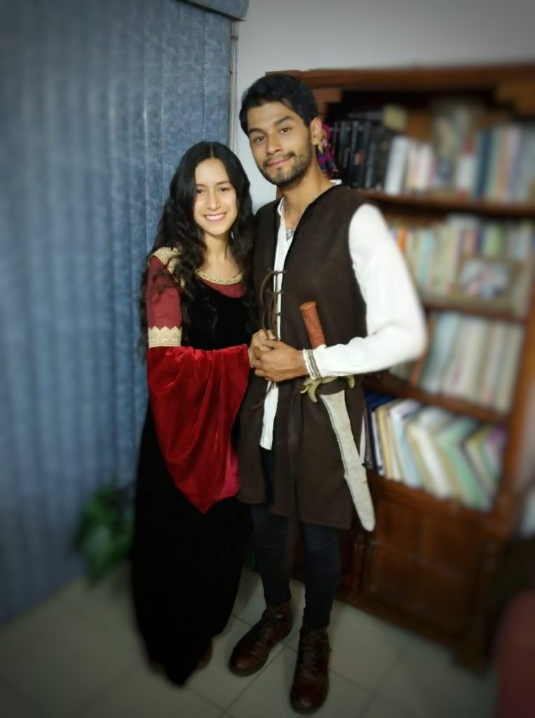 Fan Nadia and her boyfriend are wearing cosplay as Arwen in the blood red and blue dress, and as Aragorn in his leather jerkin.